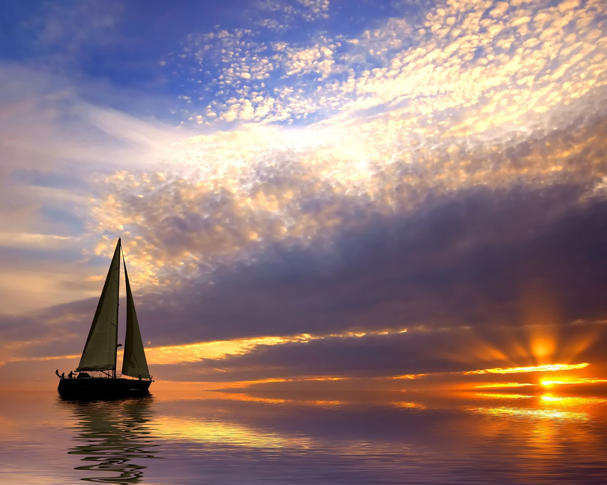 Sailing boat at sunset